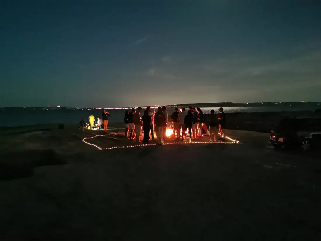 Kraken friends gathering beside the sea at night